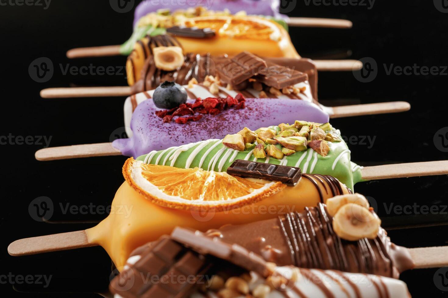 Organized, on the, surface. Tasty cheesecakes on the black background photo
