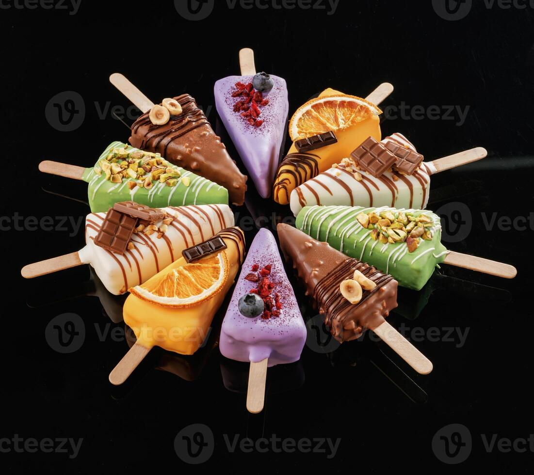 Organized,, on the surface. Tasty cheesecakes on the black background photo