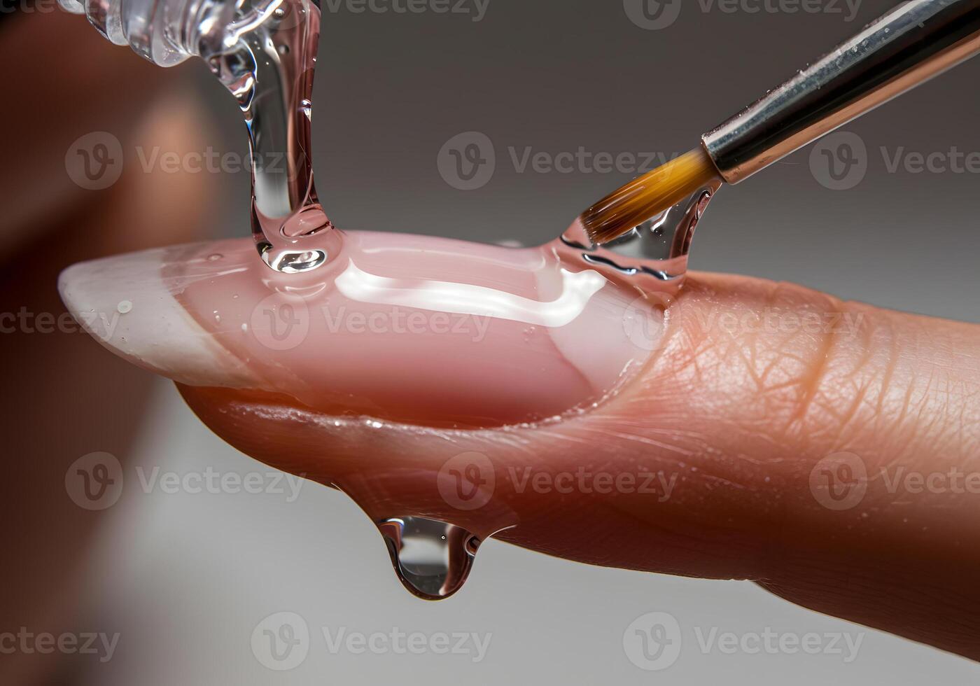 Applying nail treatment close up photo