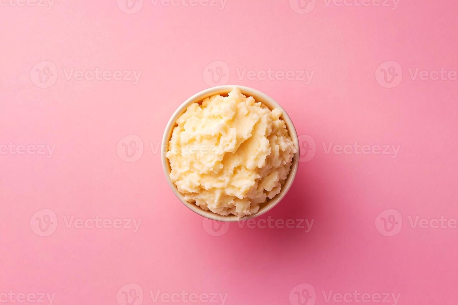 A bowl of ice cream on a pink background photo