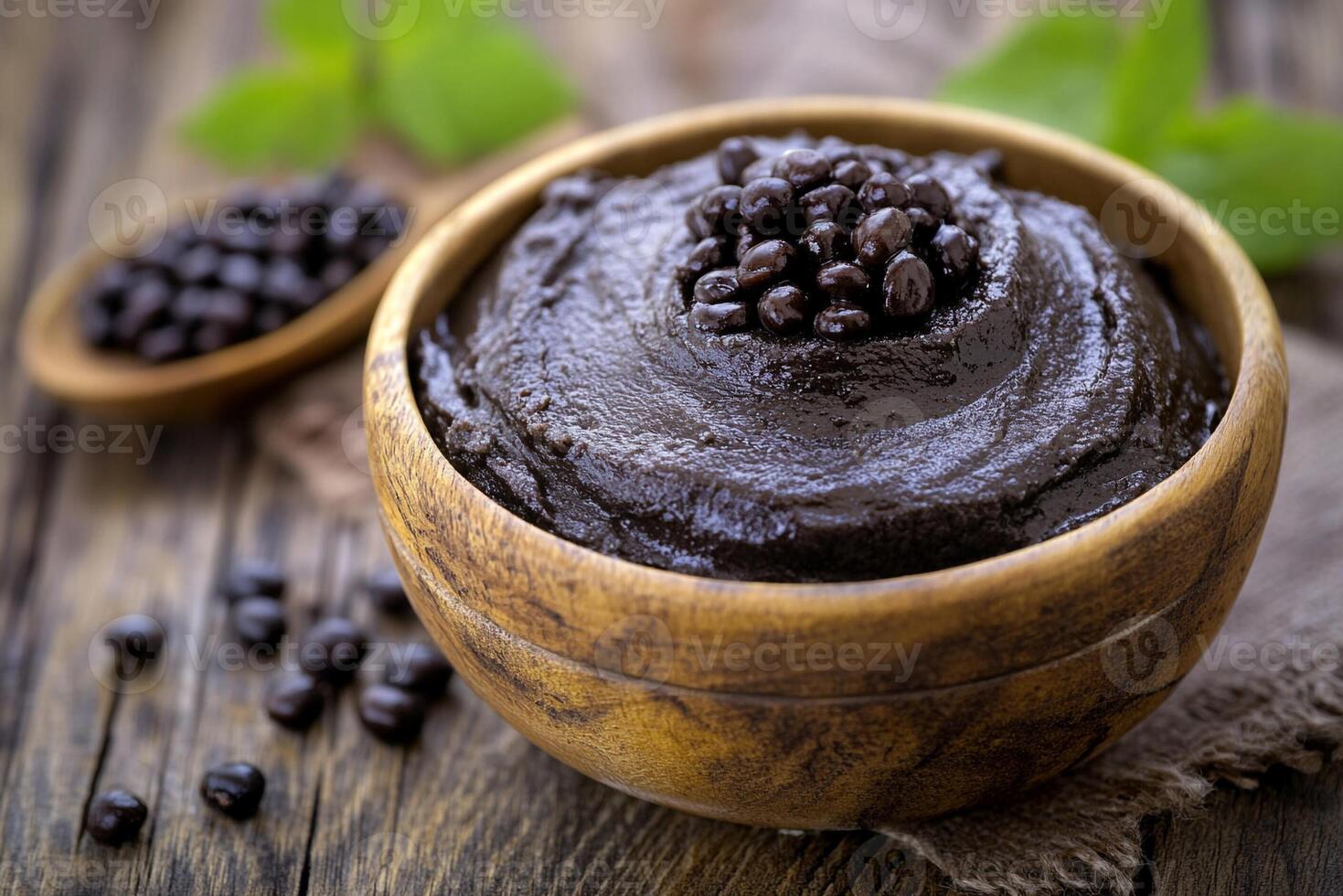 Chocolate pudding in a wooden bowl photo