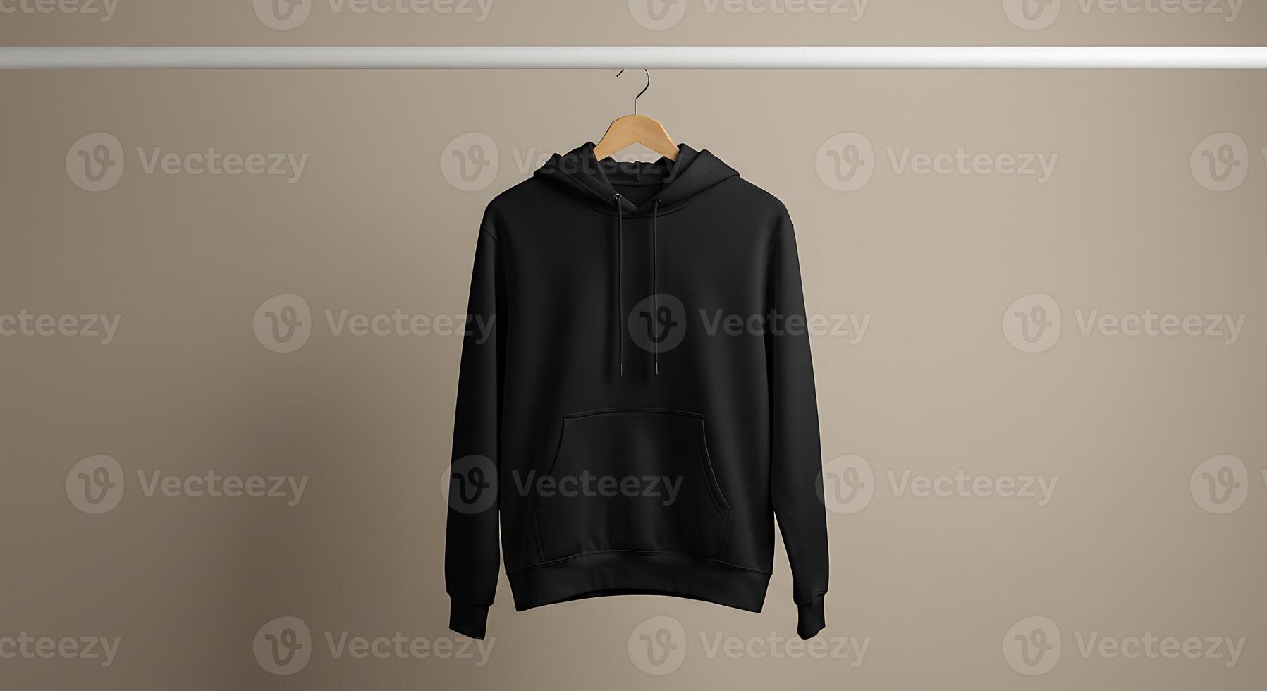 Black Hooded Sweatshirt Hanging on a Rack in Studio photo