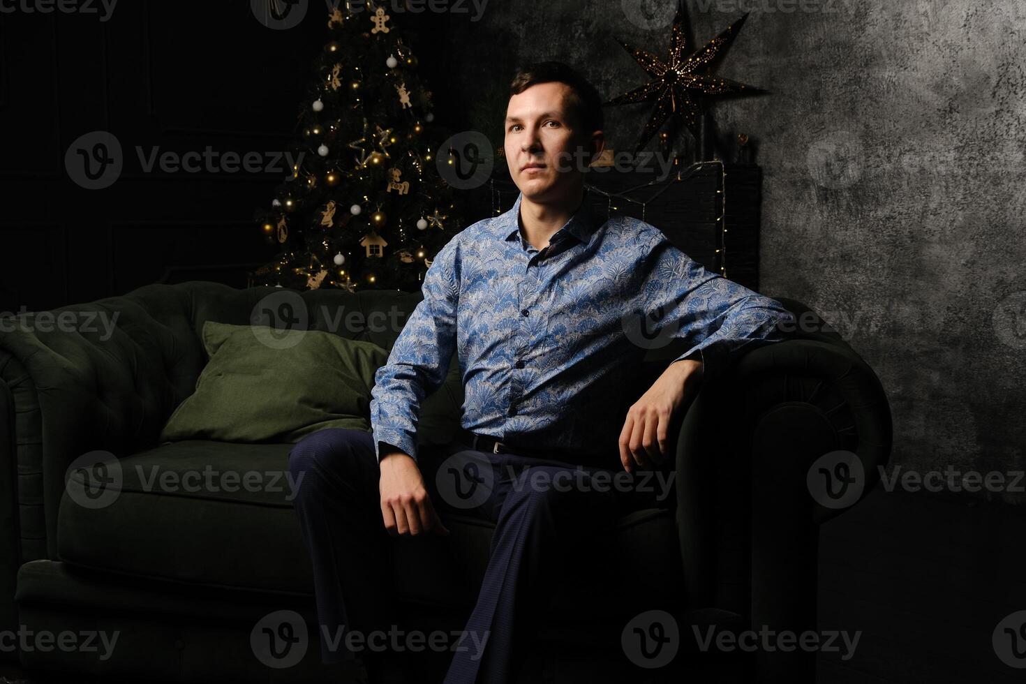 An Elegant Portrait of a Distinguished Man in a Stylish Setting with Beautiful Holiday Decor photo