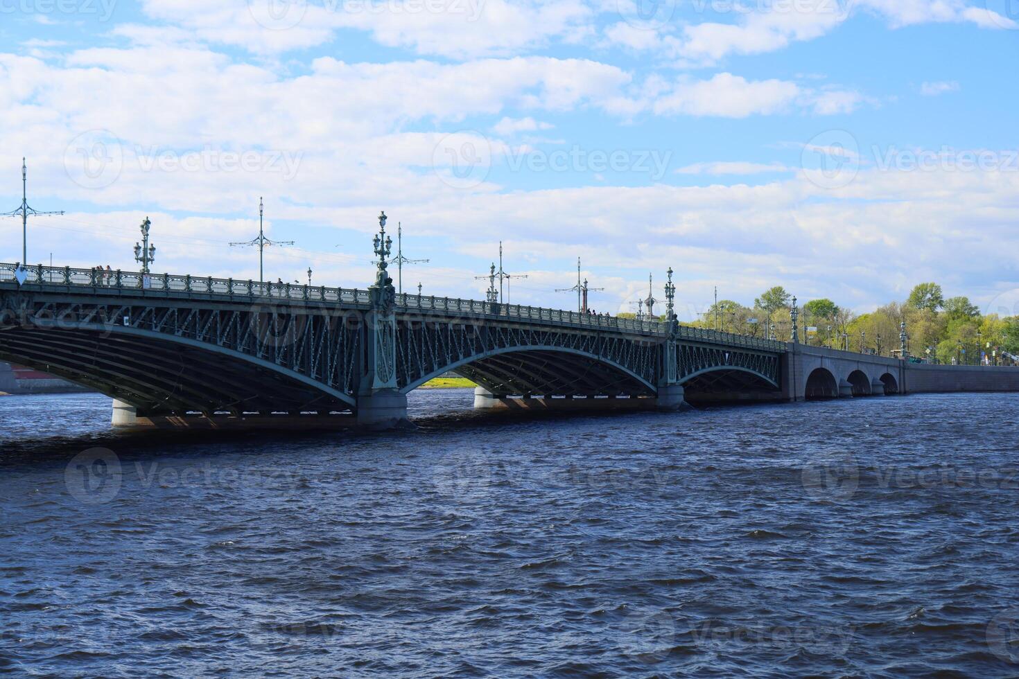 A Beautiful River Bridge Set Against an Expansive and Scenic Sky with Captivating Clouds photo