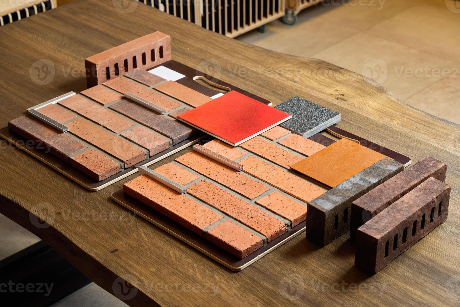 A Diverse Collection of Brick Samples Displayed on a Wooden Surface for Various Design Projects photo