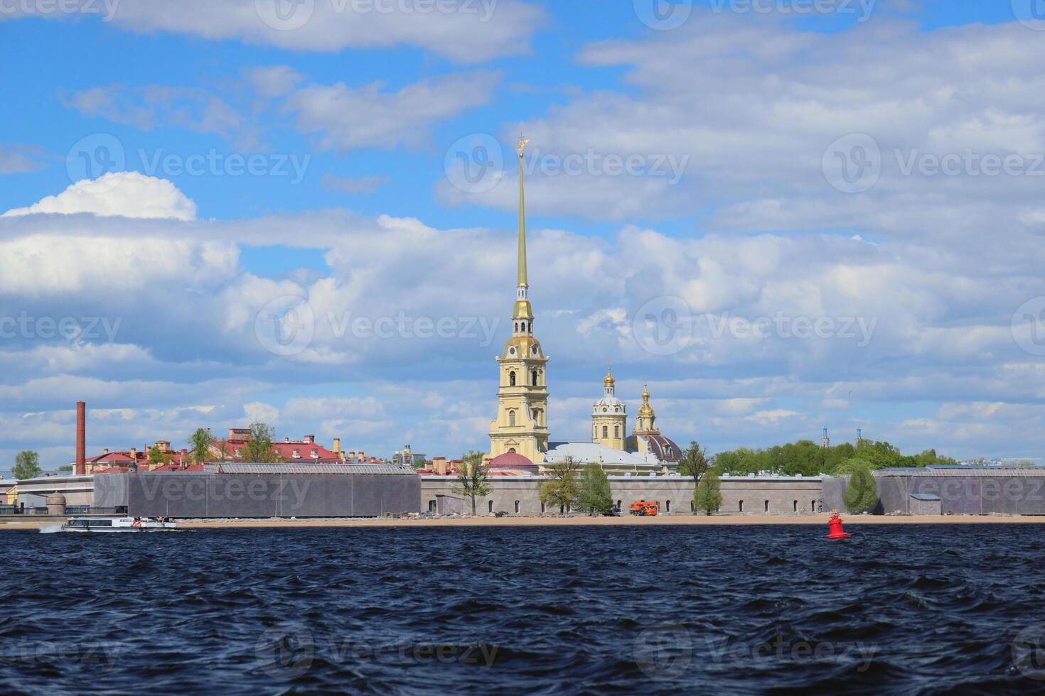 The iconic Peter and Paul Fortress stands majestically on the Neva River in St. Petersburg photo