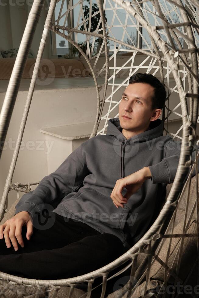 Enjoy modern relaxation in a uniquely designed hammock setting that provides tranquility photo