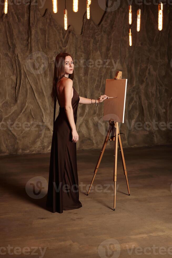 An Elegant Artist Posing in a Dramatic Setting for Creative Inspiration and Ideas photo