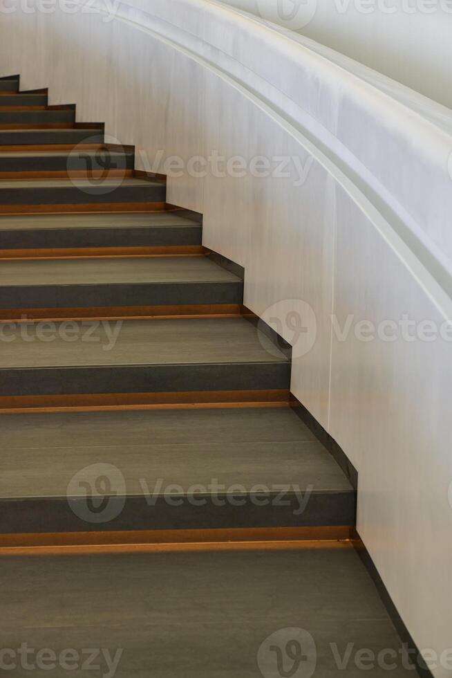 Modern Architectural Staircase Design Featuring Elegant Curved Lines and Artistic Flair photo