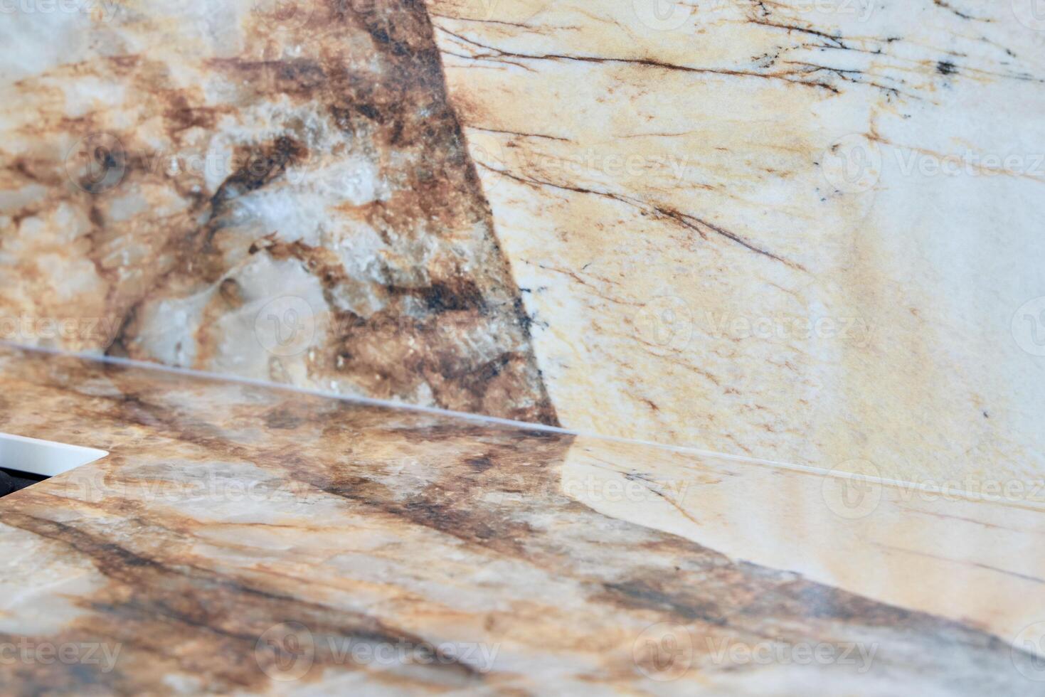 An Elegant Marble Surface featuring Beautiful Brown and Cream Veining Patterns and Textures photo