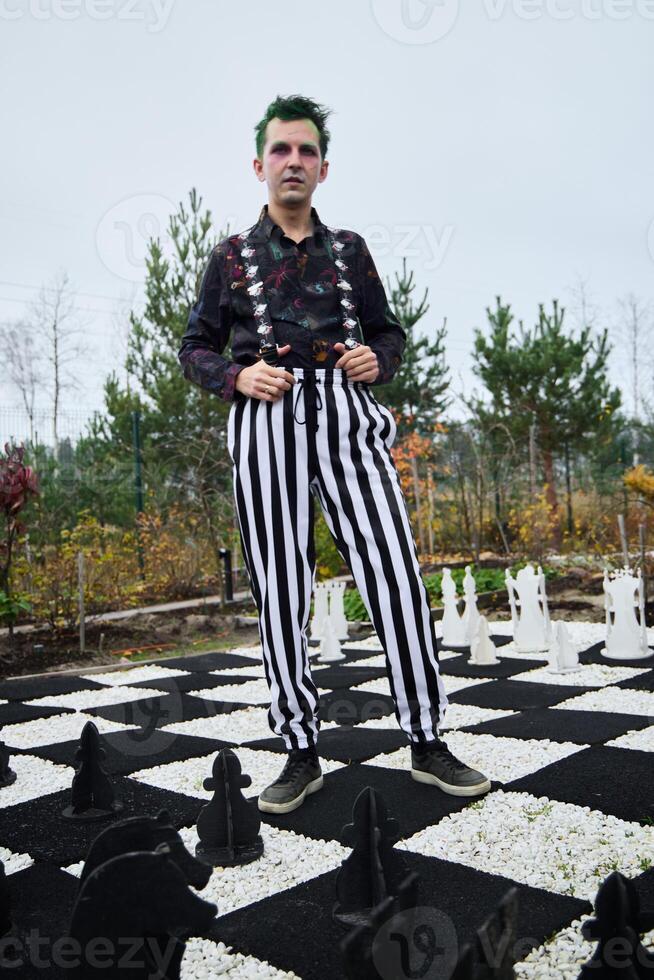 Edgy Fashion Set Against a Chessboard Landscape A Unique and Bold Style Statement photo
