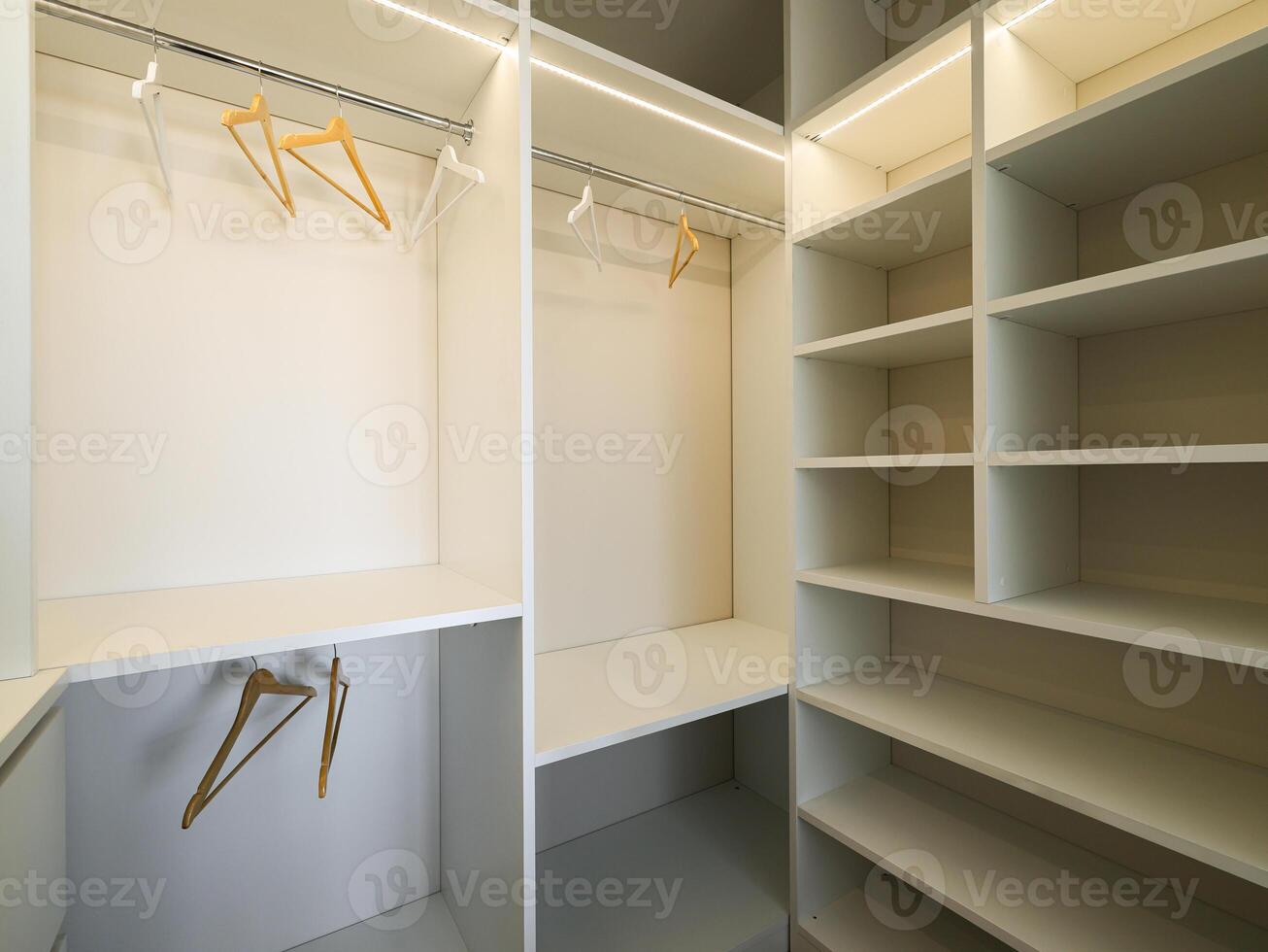 A Modern Closet Interior design featuring Hangers and Shelving for stylish organization photo