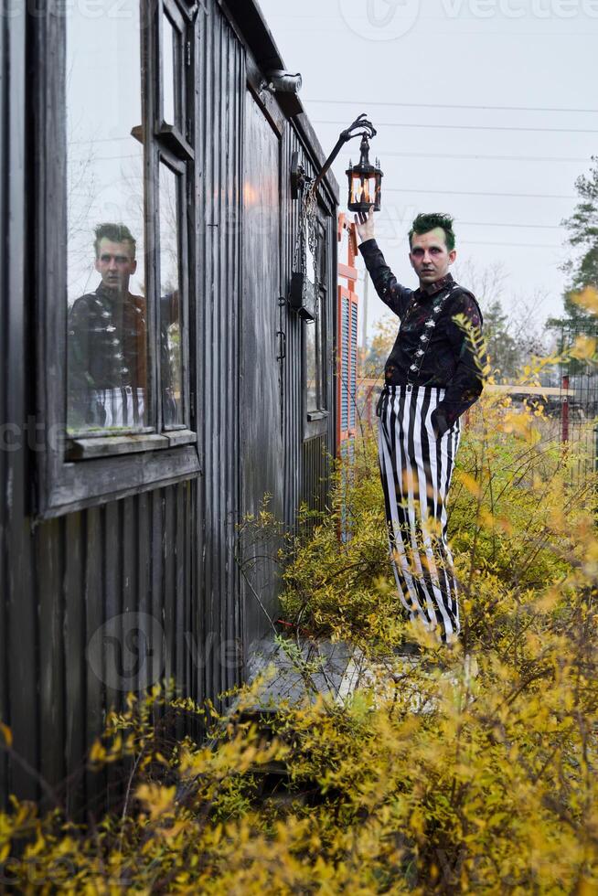 A Striking Character in a Vintage Setting, Holding a Lantern, Evoking a Unique Atmosphere photo