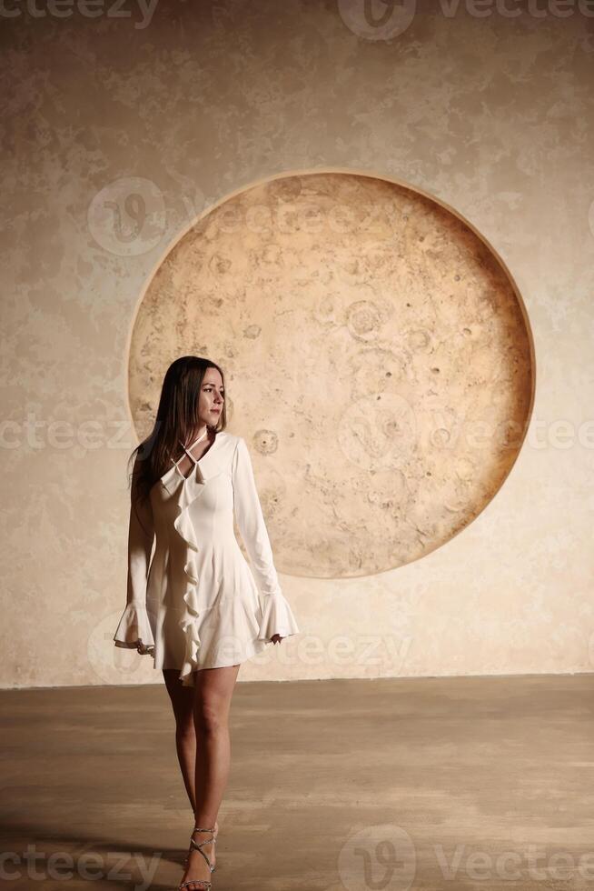 An Elegant Model Poses Gracefully Against a Beautiful Circular Artistic Background photo