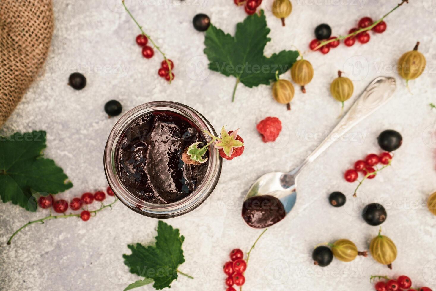 assortment of jam, seasonal berries of black, red currant, gooseberry and raspberry 7 photo