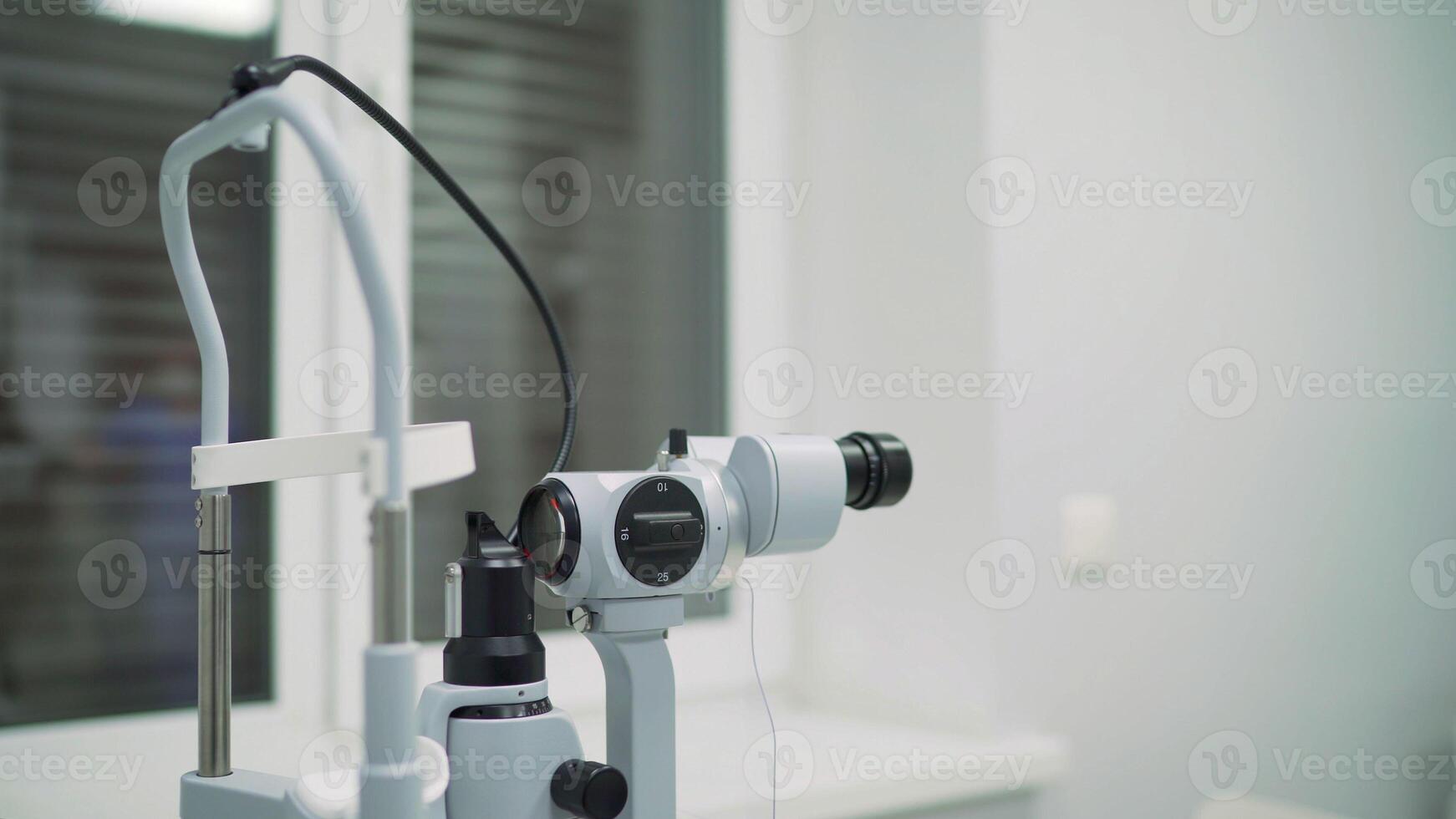 Spacious case. Tall complicated device for intense ophthalmology diagnoses made of metal and plastic Apparatus for the diagnosis of vision photo