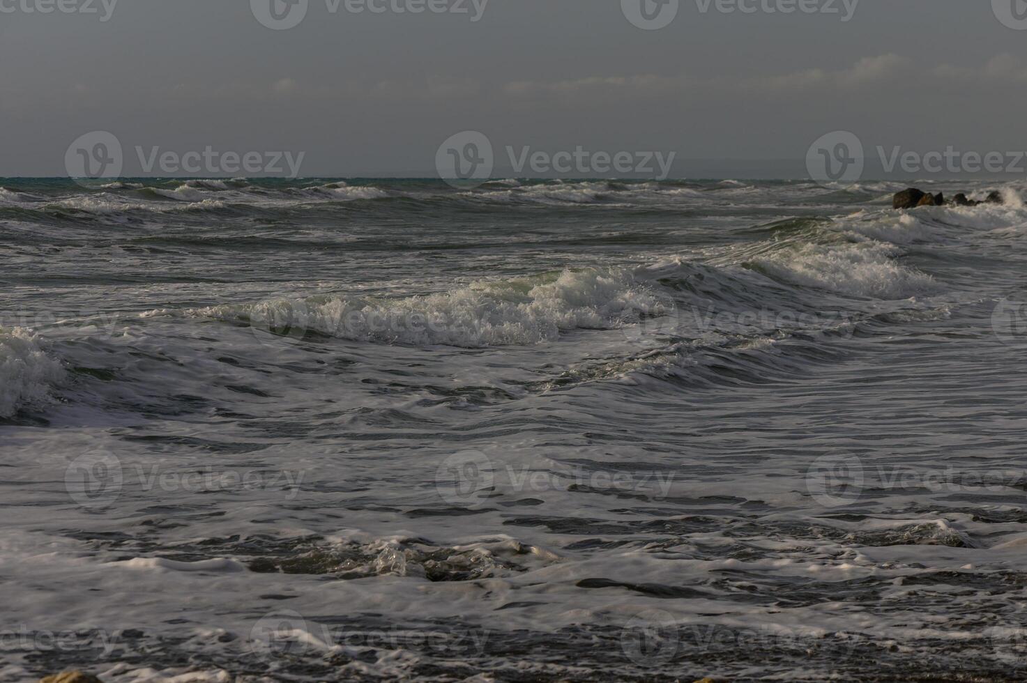 Waves in the Mediterranean Sea near beach in Cyprus photo