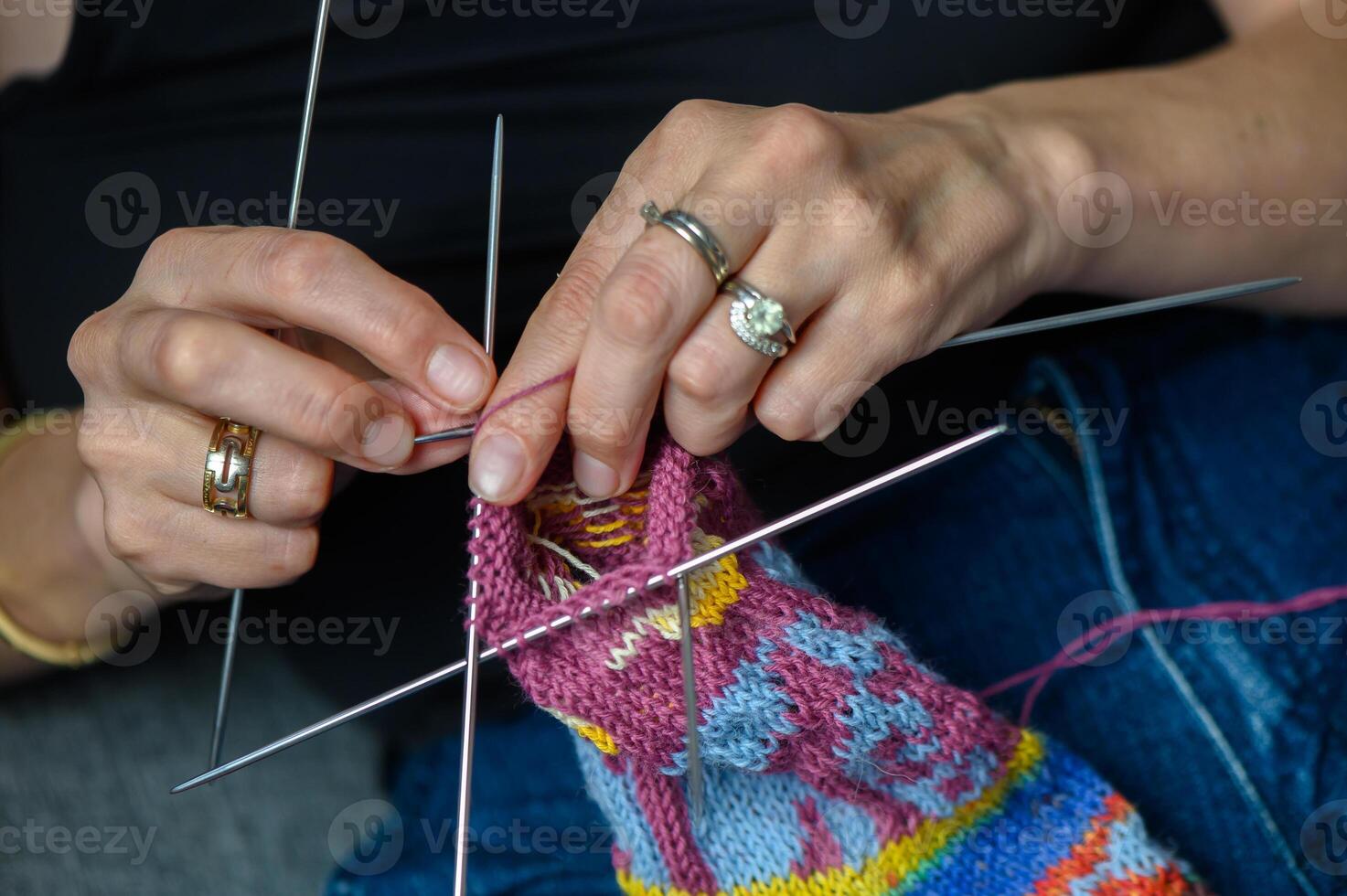 Close-Up of Woman Knitting Patterned Socks by Hand photo