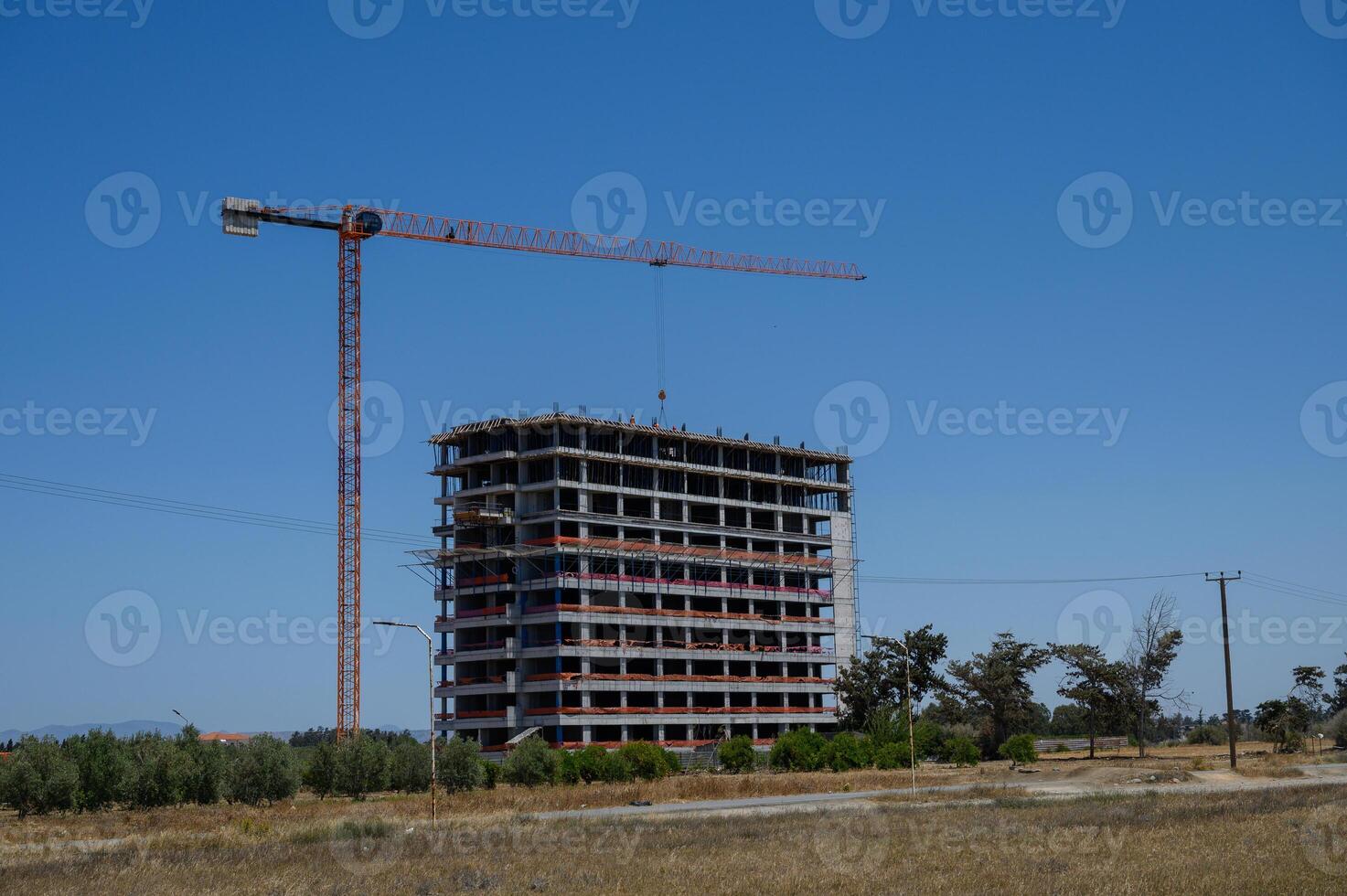 High-Rise Building Construction with Tower Crane in Cyprus photo