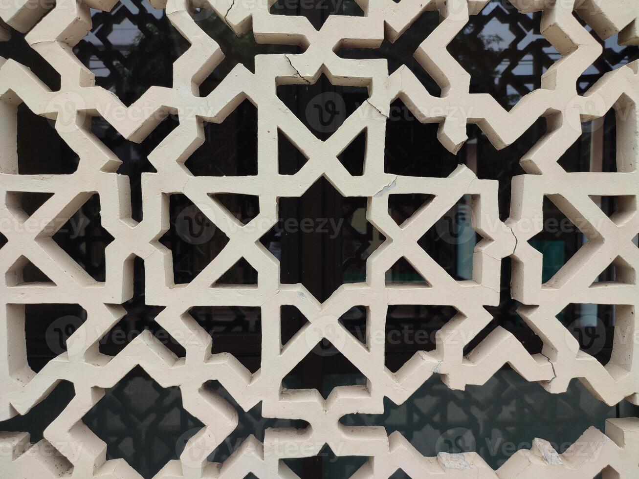 A detailed Islamic geometric mosaic featuring bright colors and symmetrical patterns photo