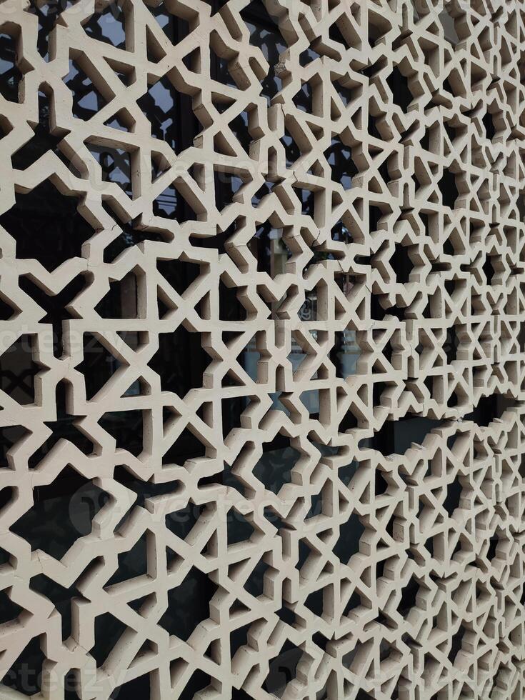 islamic lattice wall in islamic architecture photo