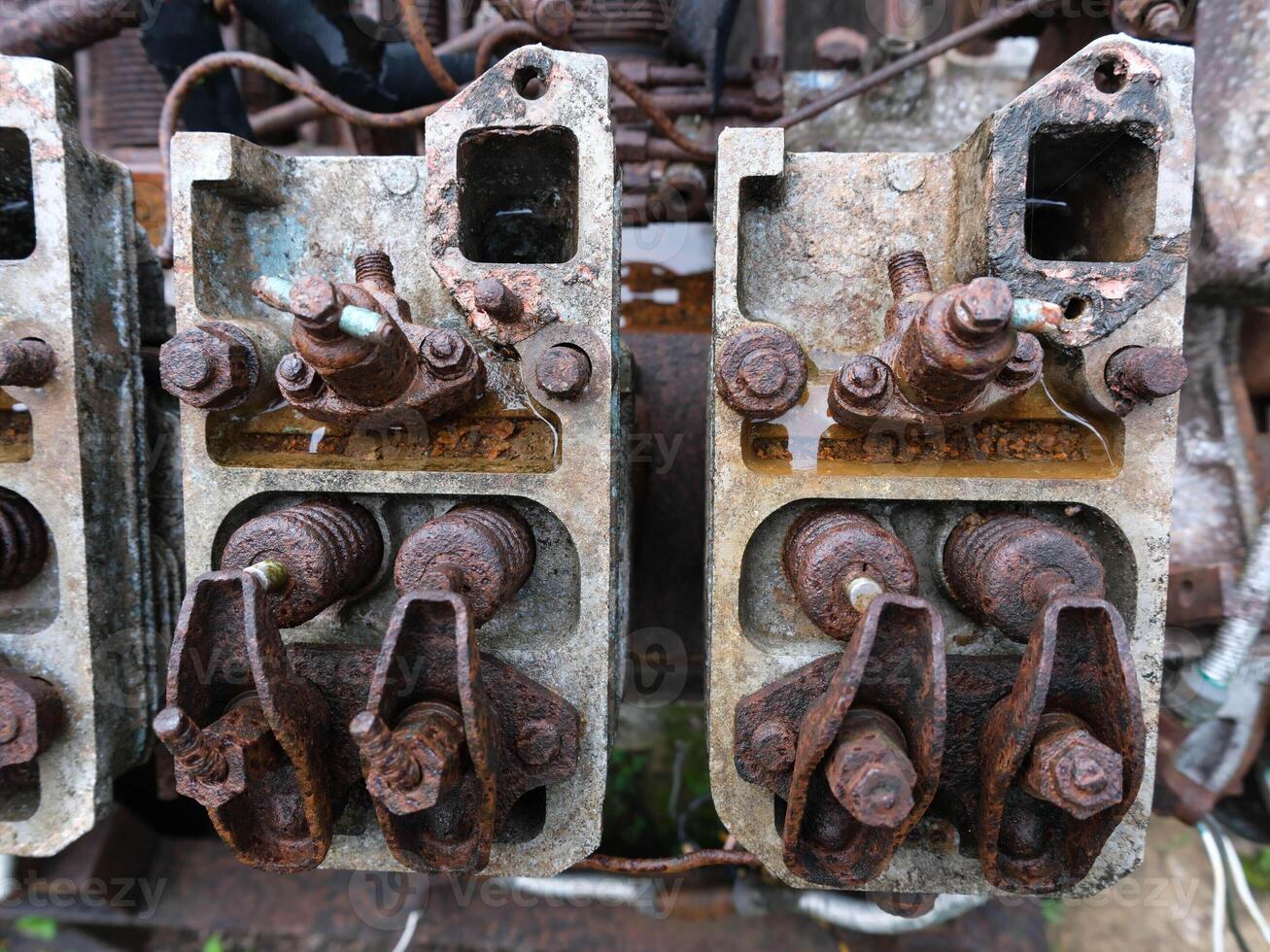 Old and rusty shock machinery ,rusty and broken machine parts photo