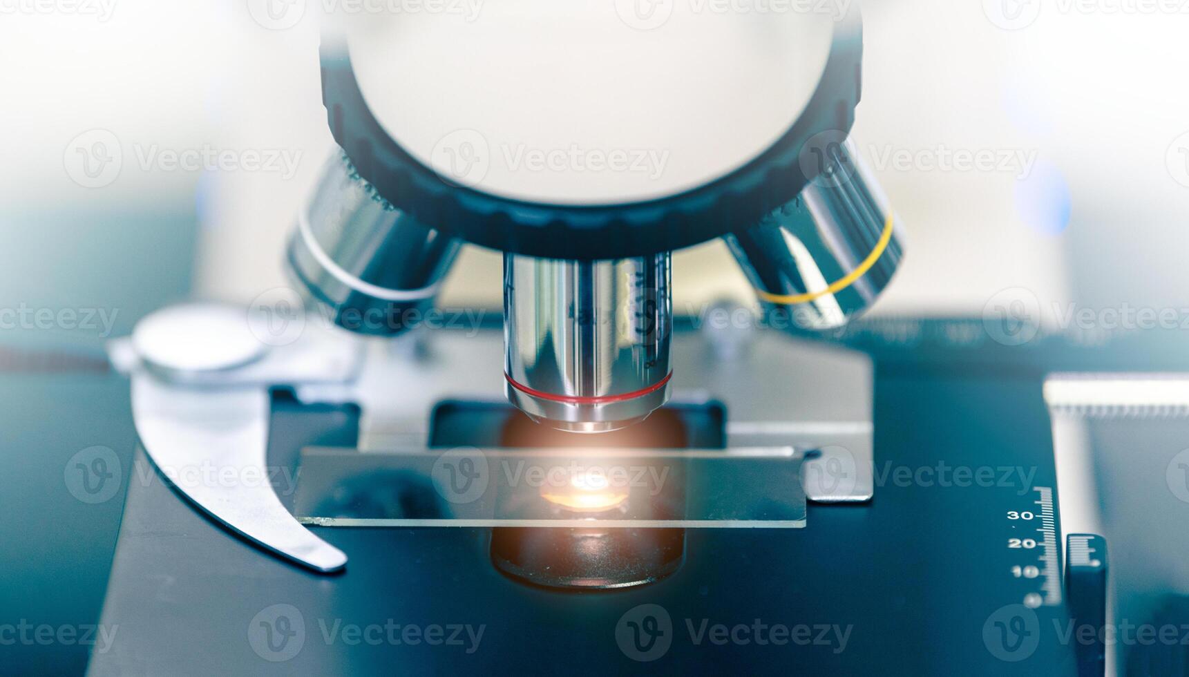 Close up of microscope with test sample photo