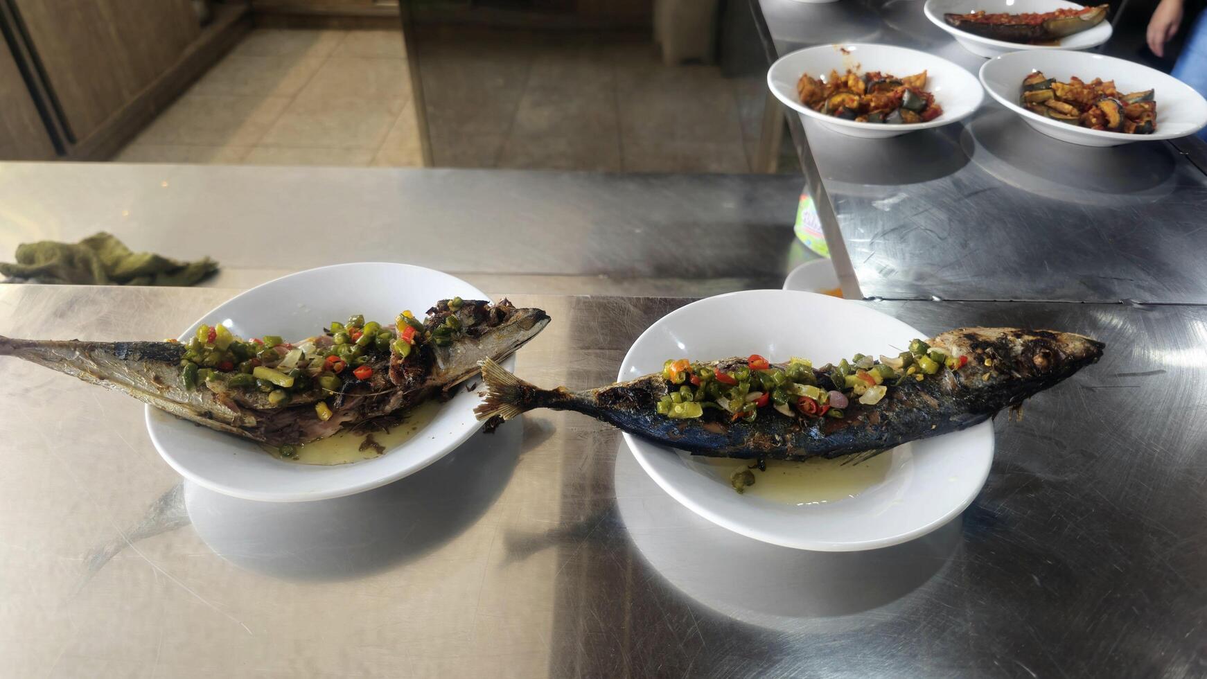 Grilled Fish with Chili Paste on a White Plate photo