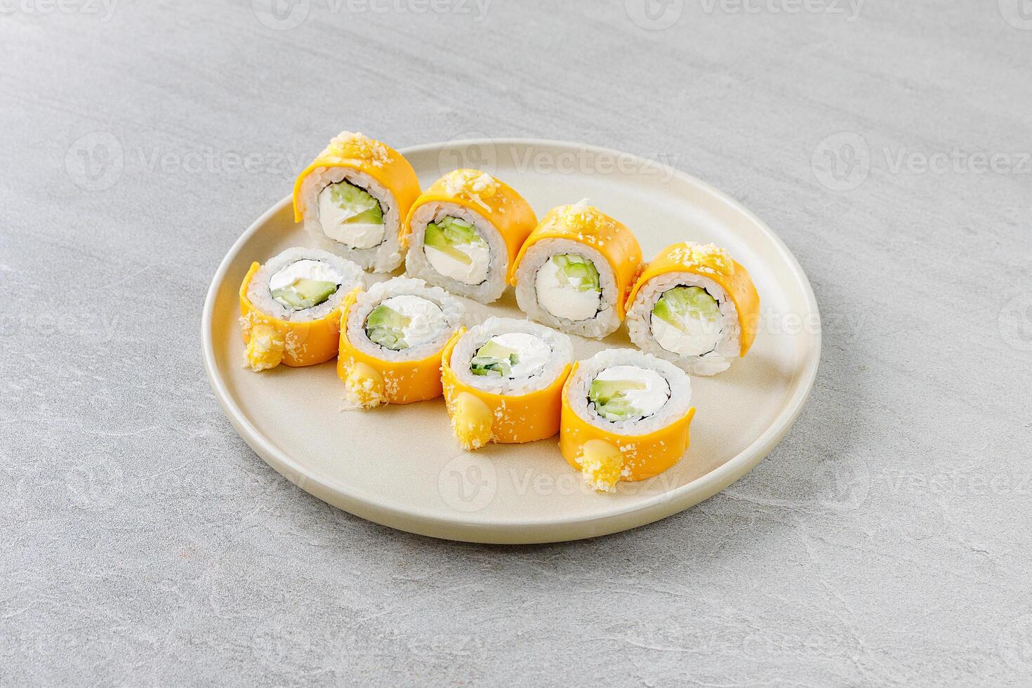 Mango Sushi Roll with Cream Cheese and Cucumber on Beige Plate photo