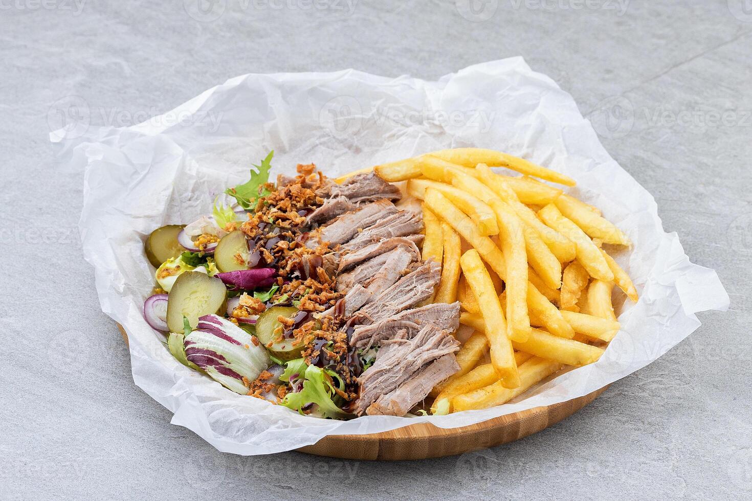 Pulled Pork Salad with Fries Pickles and Crispy Onions in Bamboo Tray photo