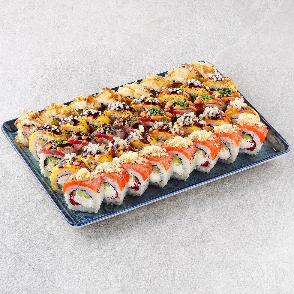 Japanese sushi rolls, sushi sets on a gray background for restaurant menu and food delivery, photo