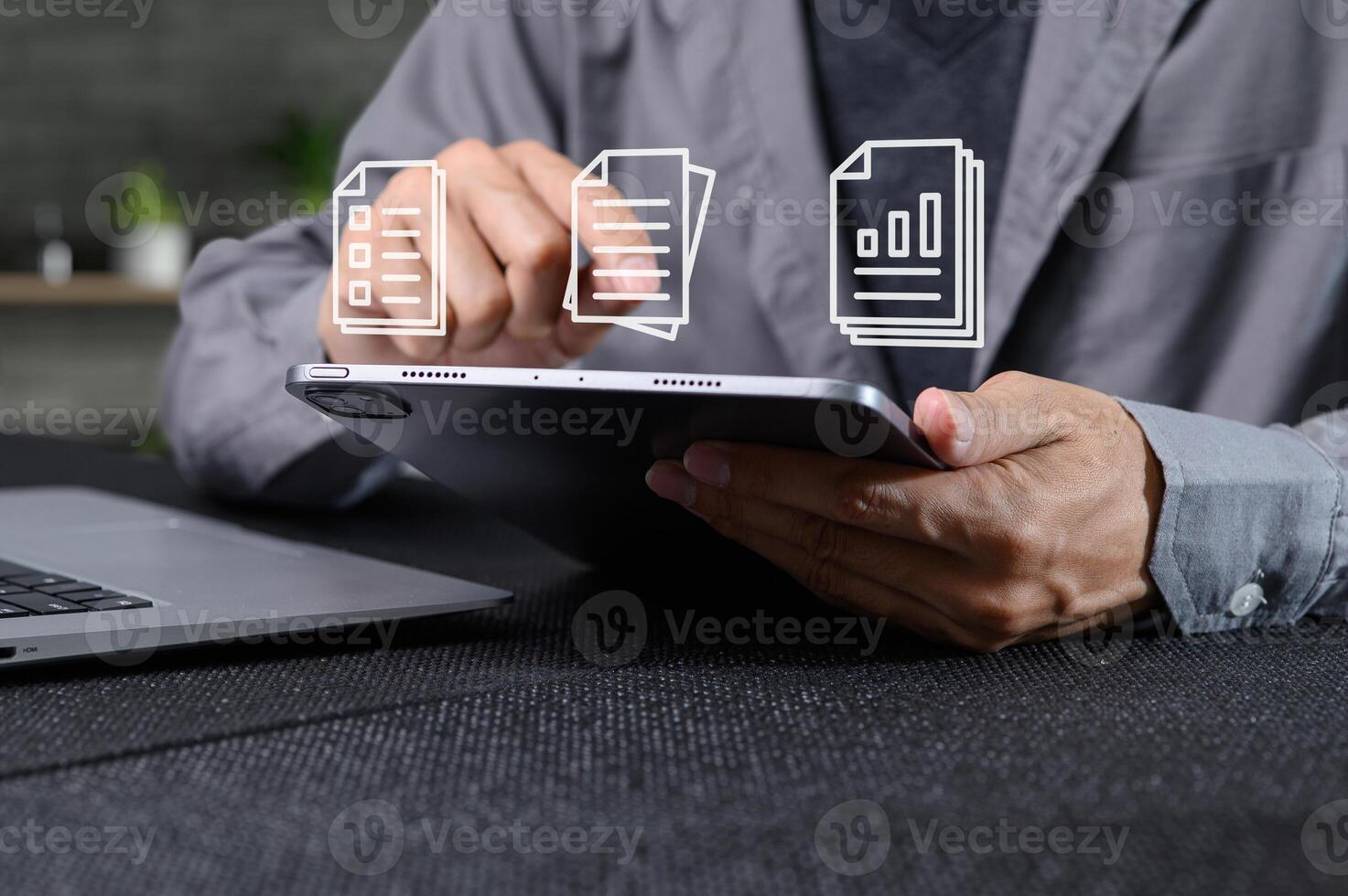 Individuals Using Digital Documents on Tablet in Modern Workspace photo