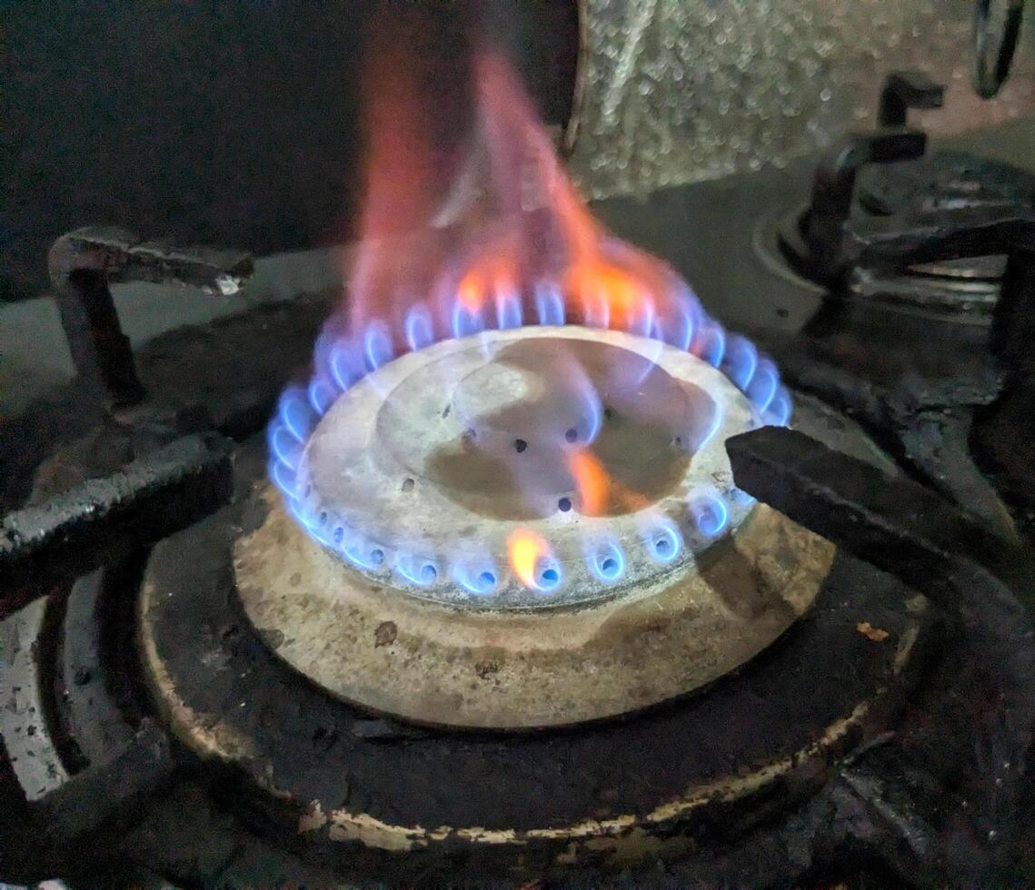 Gas burning from a kitchen gas stove top view photo
