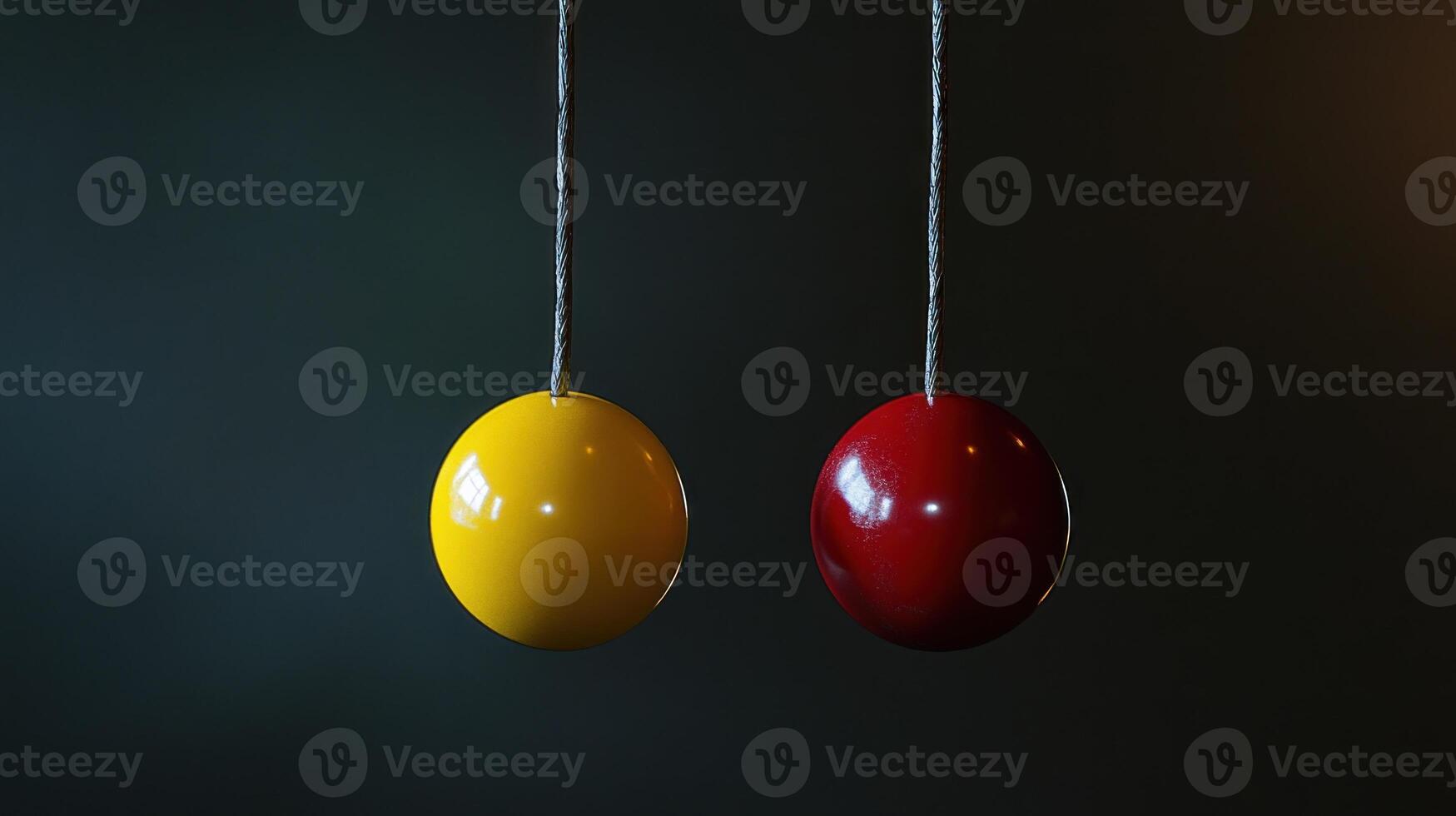 Two colorful balls hanging from strings photo