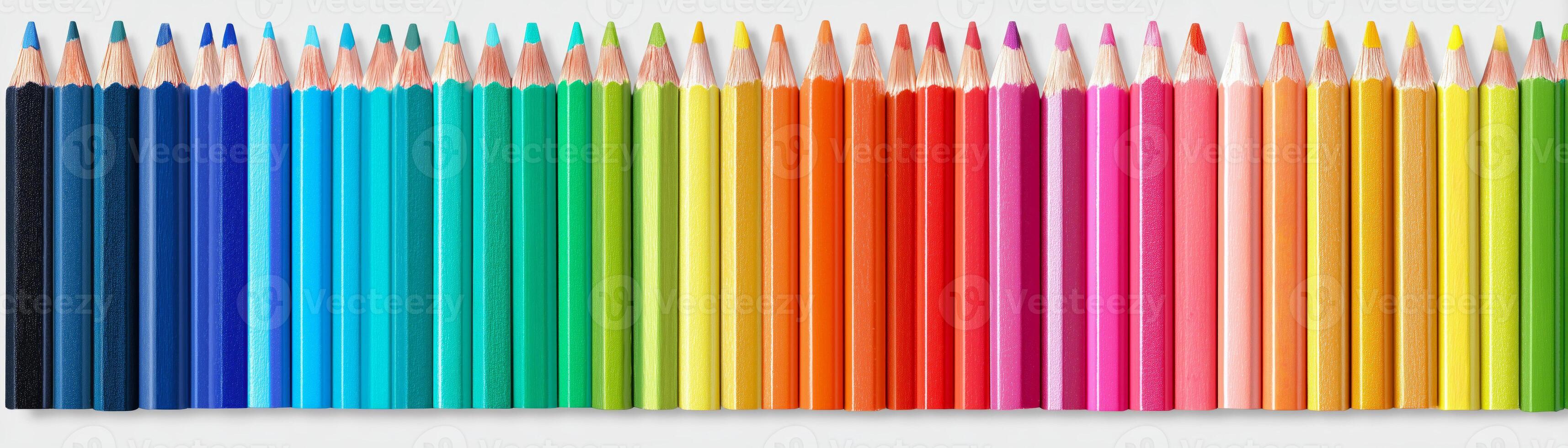 Colorful pencils arranged in a vibrant, rainbow-like sequence. photo