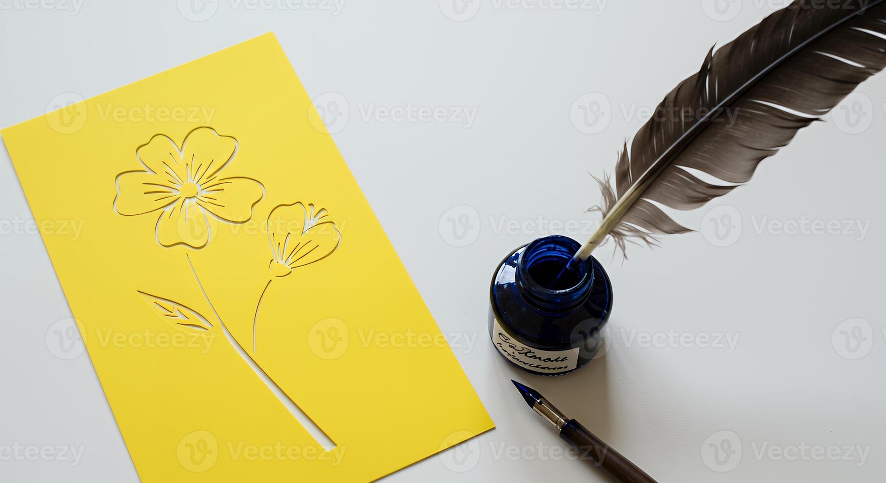 A yellow card with a flower on it next to a pen and ink photo