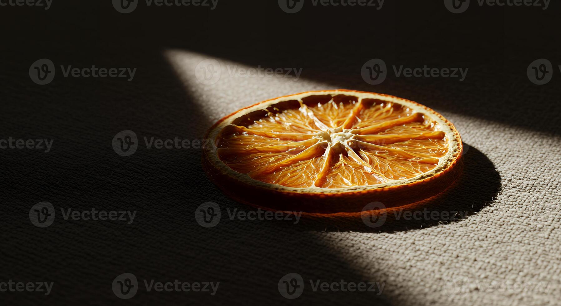 An orange slice on a table photo