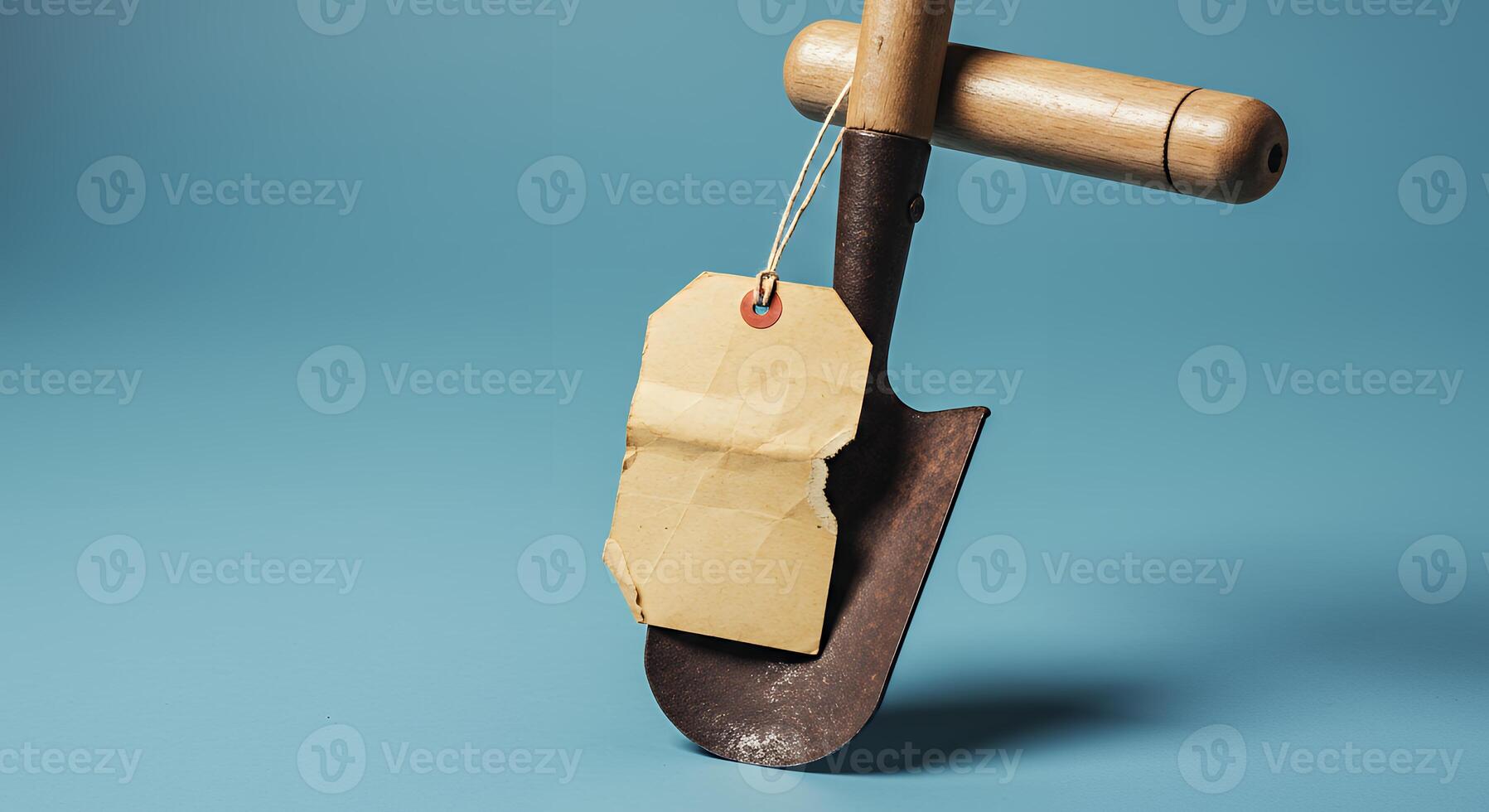 A shovel with a tag hanging from it photo