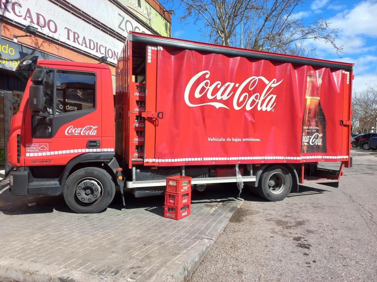 MADRID, SPAIN - MAY, 15, 2025. Coca cola delivery truck scene for beverage transportation and branding photo