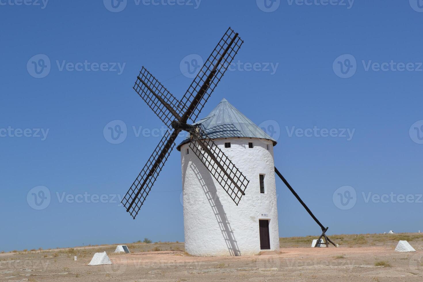 Historic windmill in la mancha, spain under clear blue skies. Campo de Criptana. La Mancha. Spain photo