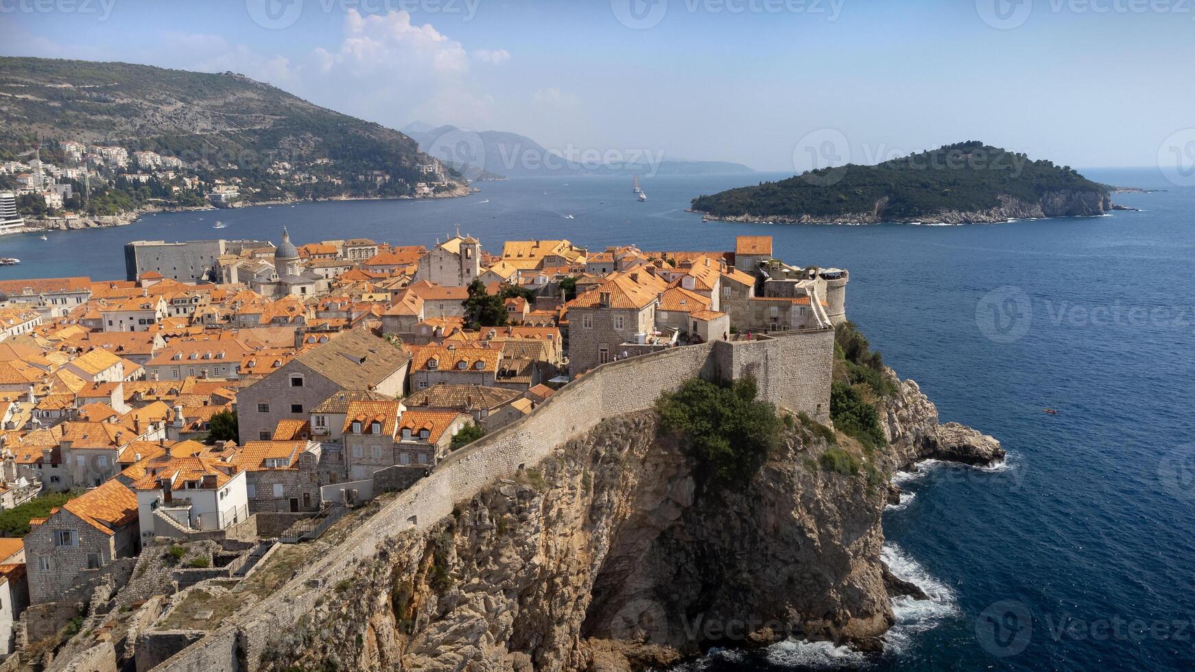 Aerial view of St. Peter fort in Dubrovnik city, Croatia. Cityscape with fortification on cliff above Adriatic sea on sunny summer day photo