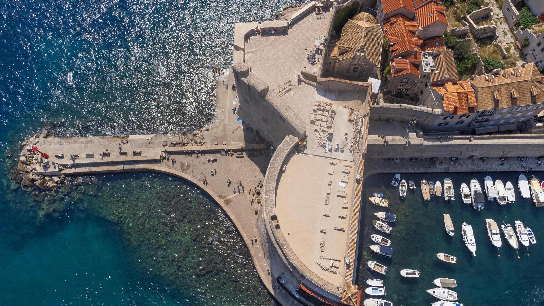 Aerial view of the tourist pier near the historic port of the tourist city of Dubrovnik on the coast of Croatia. Porporela is an attraction in the historic center of the town photo