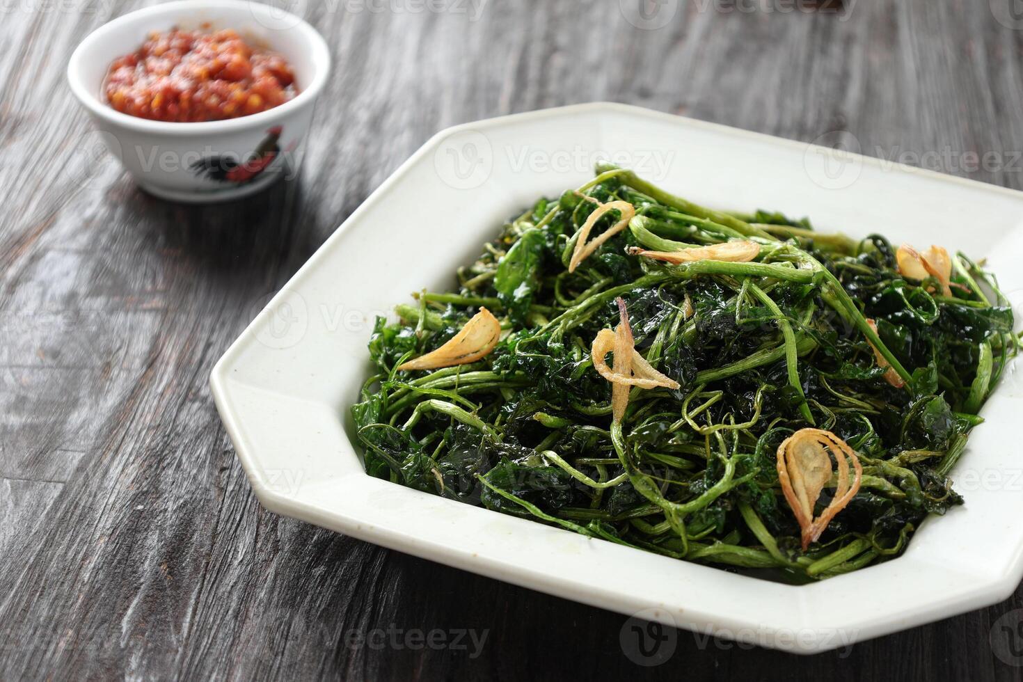 Jukut Goreng or Selada Air Goreng, Deep Fried Watercress with Salt and Fried Onion photo