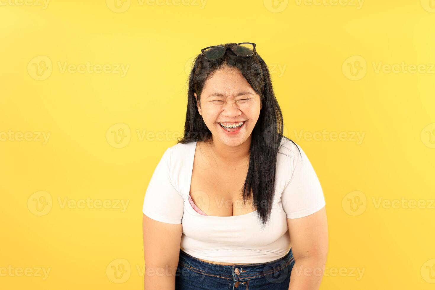 Beautiful Fat Asian Woman Laughing With Eyes Closed photo