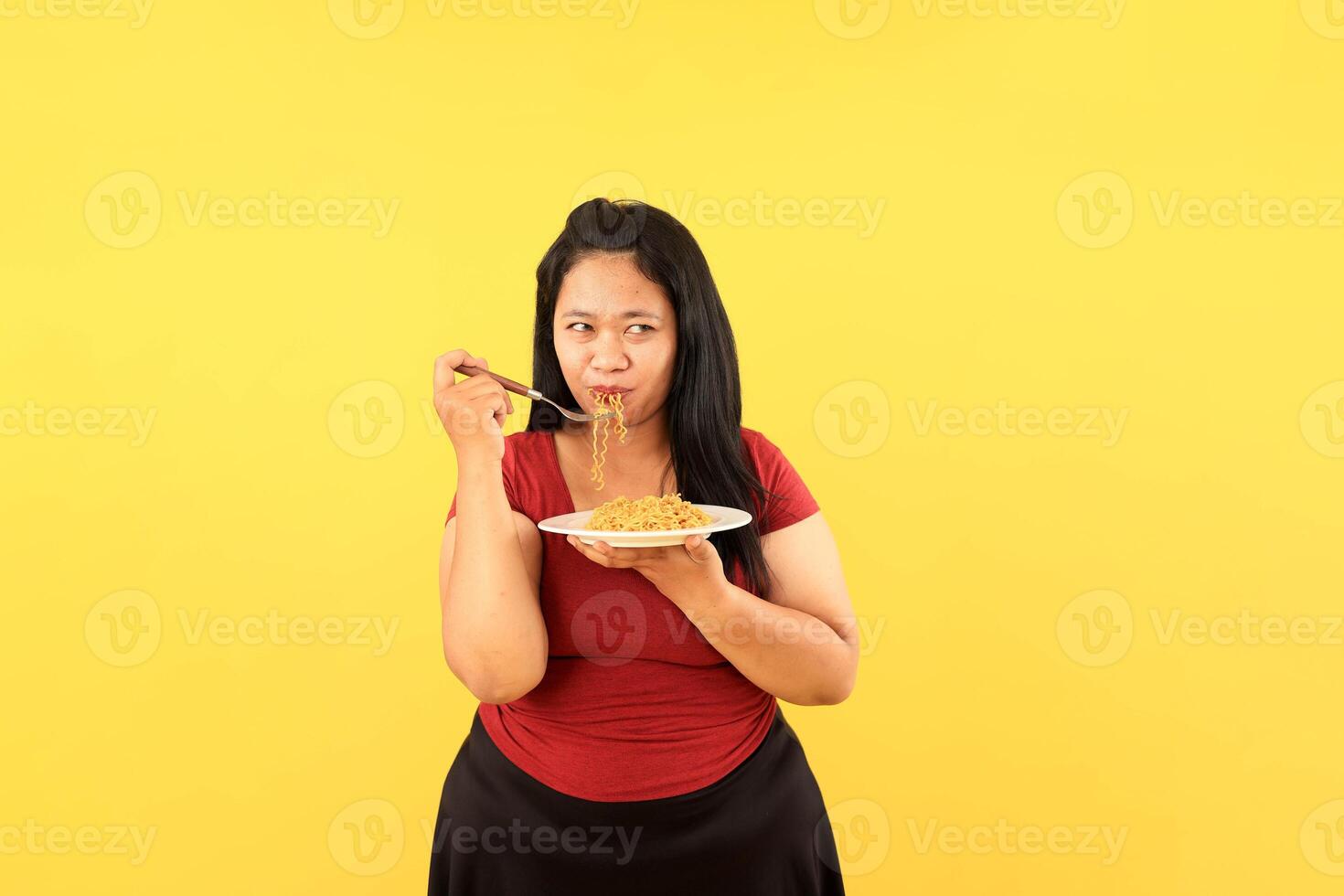 Woman Eating Instant Noodle with Bombastic Side Eye photo
