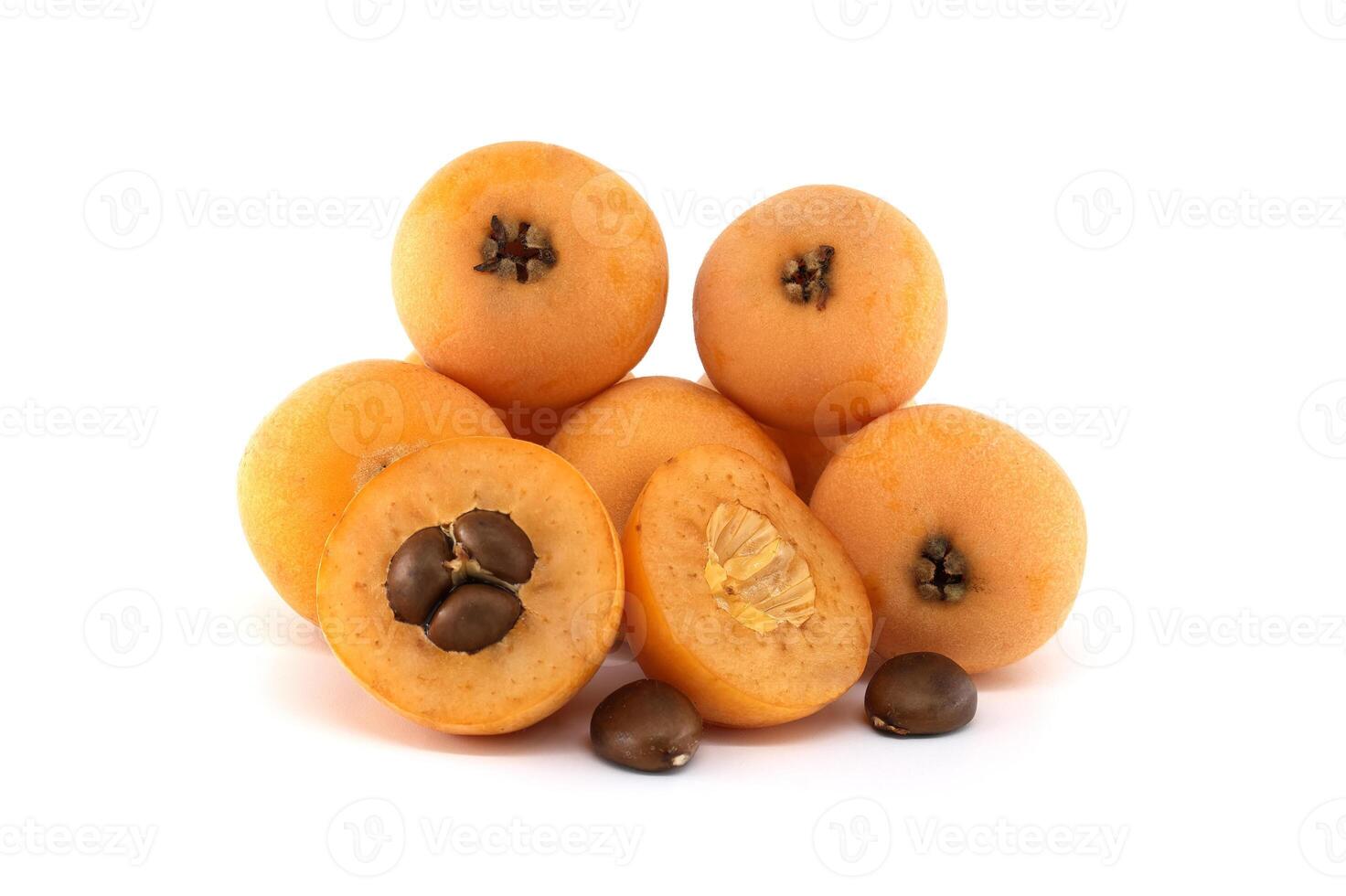 Loquat fruits and seeds showing pulp and peel isolated on white background photo