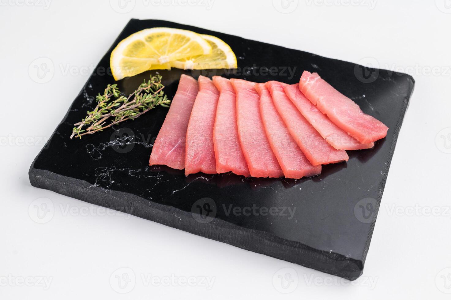 Premium quality tuna sashimi, ideal for a refreshing appetizer or light meal that delights the senses. isolated on white background. top view photo