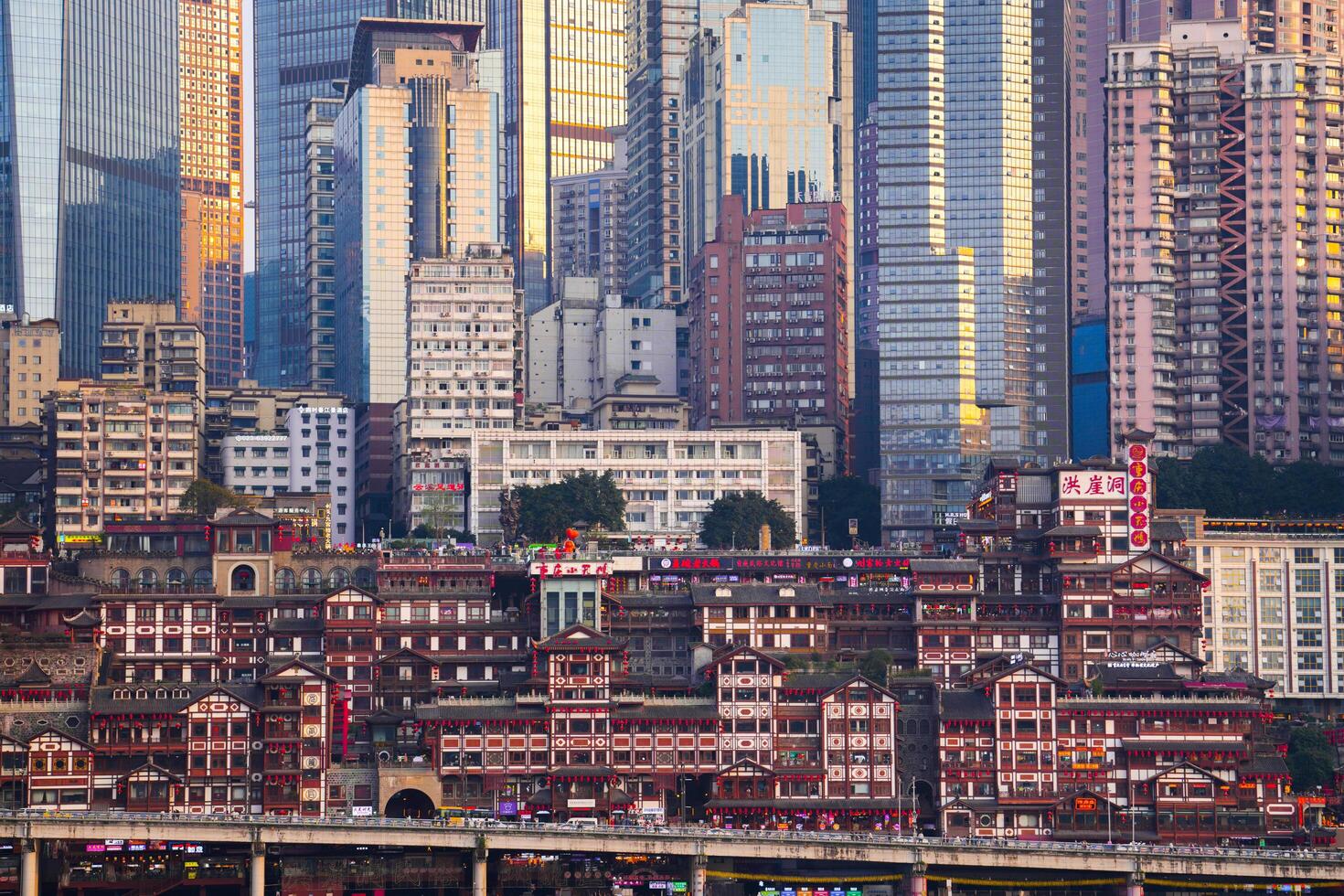 Chongqing, China-APR 02, 2025- Cityscape of the famous downtown shopping complex Hongyadong with illuminated bridge and highrise building in Chongqing photo