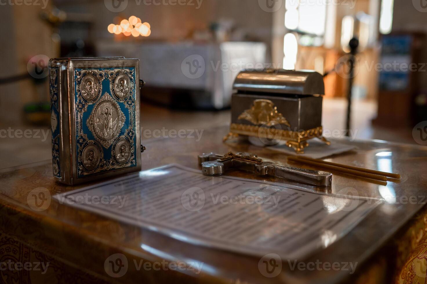 A small table with a silver box and a pen photo