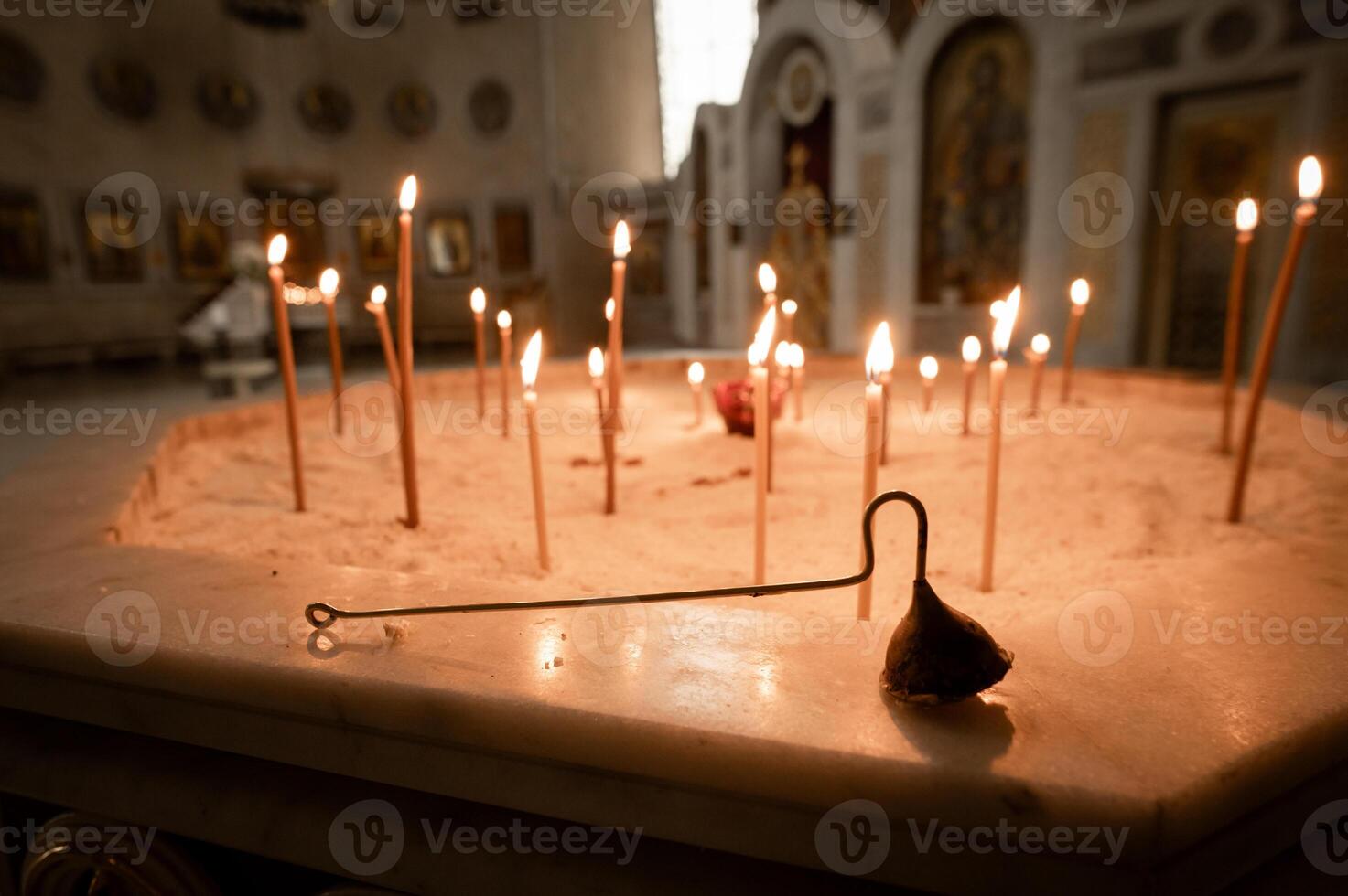 A candle is lit in a church photo